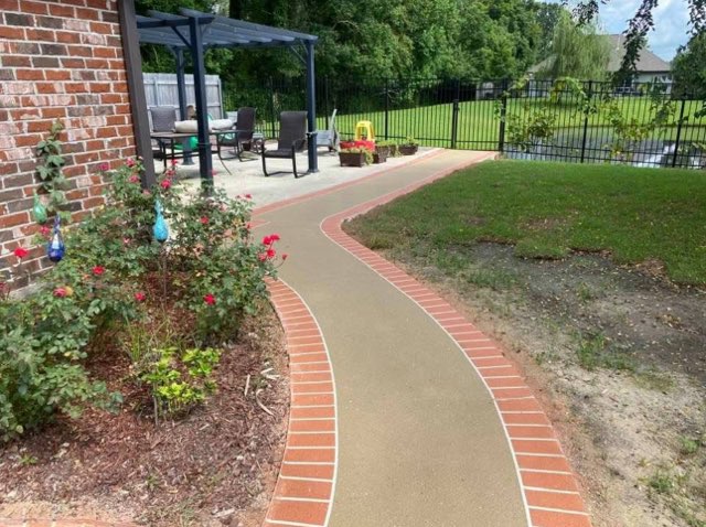 Decorative walkway with brick-look borders