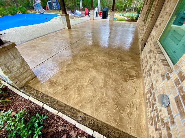 Decorative concrete overlay patio by Rockwood Custom Concrete