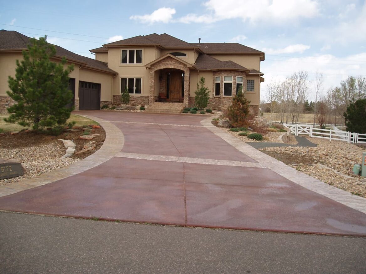 Stained red concrete driveway