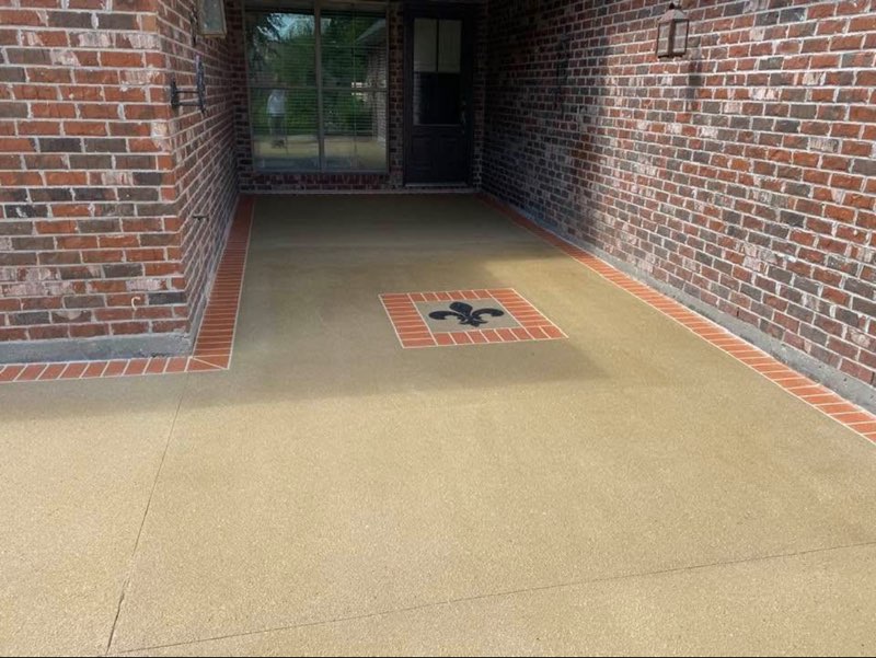 Covered entry with fleur-de-lis medallion